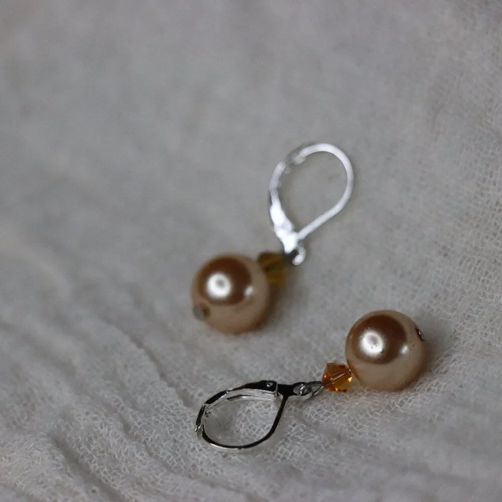 Round Peach Pearl styled drop earrings with silver color loops for pierced ears